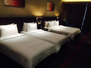 Hotel Grandis in Kota Kinabalu, image may contain: Hotel, Furniture, Bed, Cushion