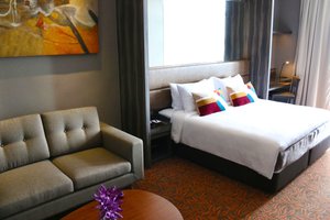 Aqueen Hotel Paya Lebar in Singapore, image may contain: Couch, Furniture, Bed, Bedroom
