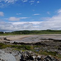 Brighouse Bay with sun breaking the clouds