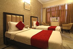 Le Grand Hotel in Haridwar, image may contain: Bed, Furniture, Cushion, Home Decor