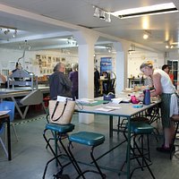 An active and lively studio full of printmakers working