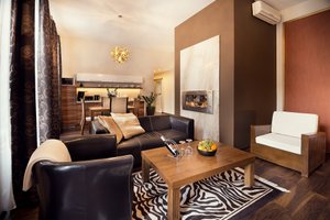 City Residence Apartment Hotel in Kosice, image may contain: Home Decor, Couch, Living Room, Table