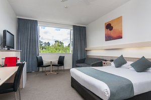 Comfort Inn Regal Park in Adelaide, image may contain: Dorm Room, Furniture, Monitor, Chair