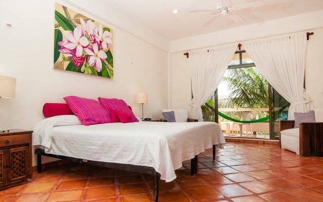 Spacious upper level room with a king size bed and breezy balcony with a hammock, 