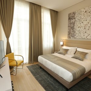 Zepter Hotel in Belgrade, image may contain: Home Decor, Living Room, Table, Chair