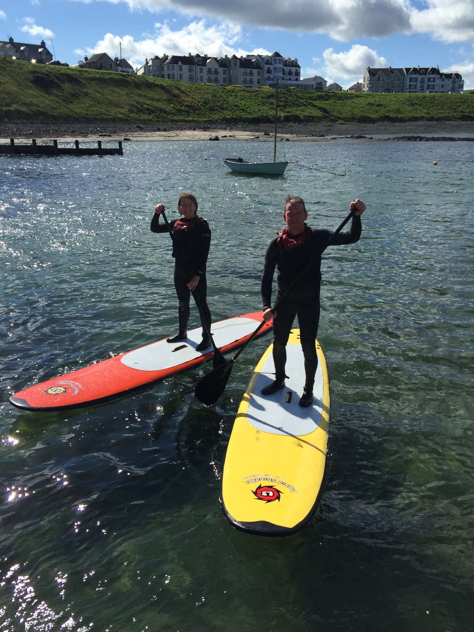 surfs up paddle boarding