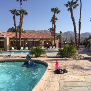 Soaking in Hot Springs. Mountains in background.