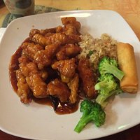 General Taso's chicken with fried rice, broccoli and a spring roll