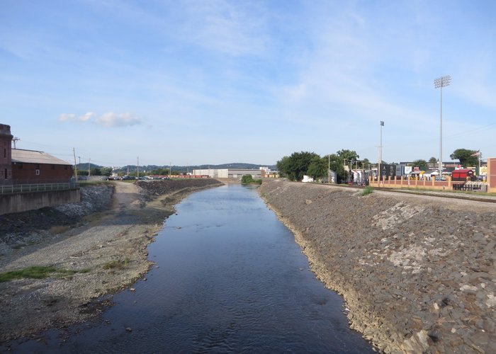 Main parking lot on the left, creek, stadium on the right