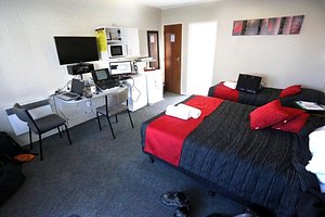 Fiesta Court Motel in Whanganui, image may contain: Dorm Room, Furniture, Bed, Chair