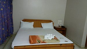 Hotel Sonar Tori in Puri, image may contain: Bed, Furniture