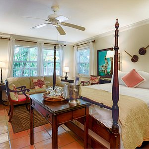 The Caribbean Court Boutique Hotel in Vero Beach, image may contain: Ceiling Fan, Electrical Device, Interior Design, Table