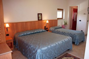 Albergo Il Giardino del Rio in Castel di Sangro, image may contain: Furniture, Bed, Bedroom, Painting