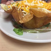 flavorful taco salad in an overcooked greasy shell