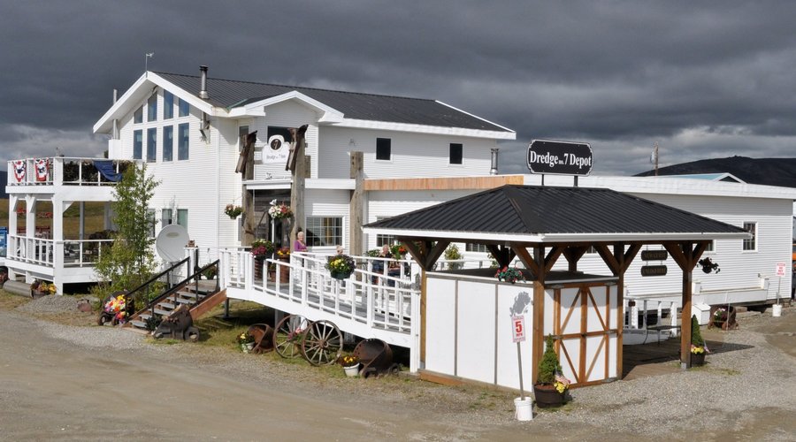Dredge NO. 7 Inn, located 1700 Teller Highway.  Depot in foreground starts your journey in Nome.
