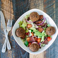 Our Greek Salad topped with our famous Felafels