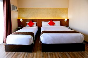 Isabela Zen Hotel in Panay Island, image may contain: Furniture, Bedroom, Bed, Indoors