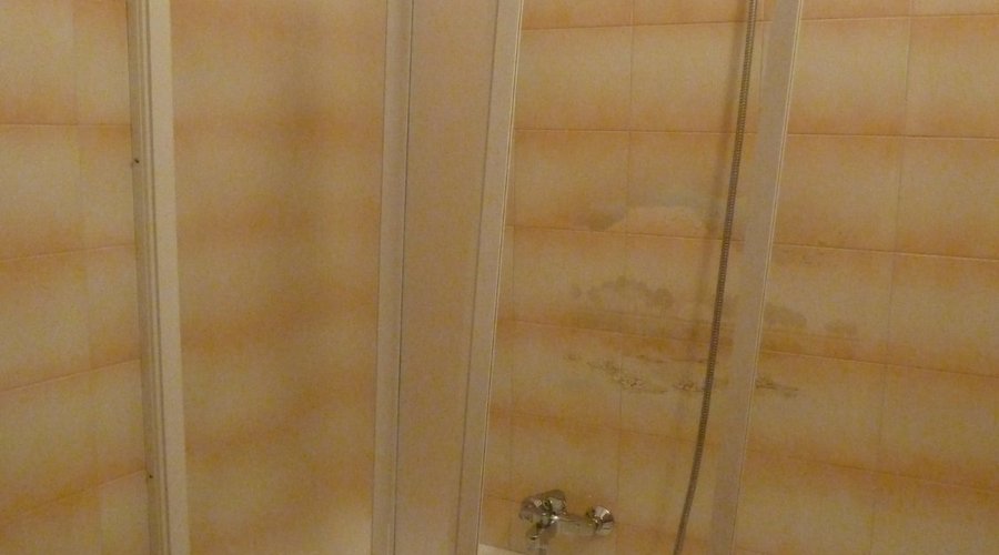 Broken and badly hung shower screen