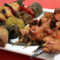 Pork bbq sticks in the foreground