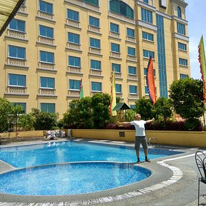outdoor pool on a hot sunny day at Royal Mandaya Hotel