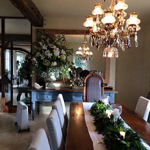 The French Country House in Tauranga, image may contain: Dining Table, Chandelier, Dining Room, Table