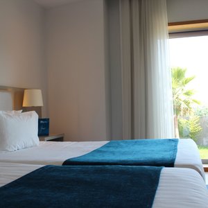 OPO Hotel Porto Aeroporto in Maia, image may contain: Furniture, Bed, Bedroom, Lamp