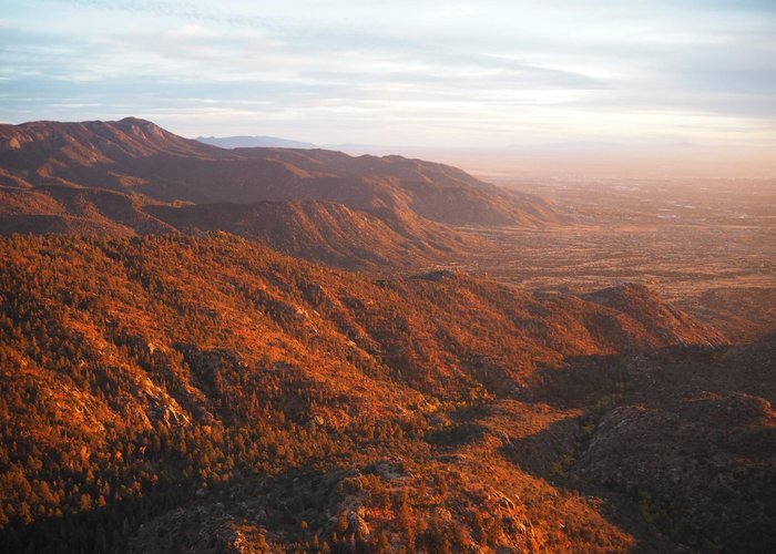 View on Sandia Mountain from Sandia Tramway cabin, while we were descending during sunset.