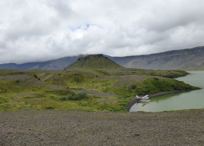 Surprise Lake in caldera of volcano, shows the little plane we flew in