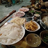 Rice, needle mushrooms, fish, other veggies...and spam (ordered by accident)