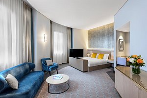 Radisson Blu Plaza Hotel Sydney in Sydney, image may contain: Living Room, Home Decor, Coffee Table, Couch