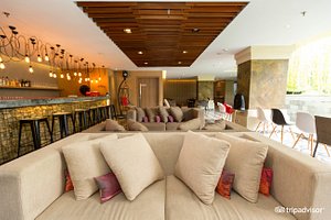 Grand Zuri Kuta Bali in Kuta, image may contain: Couch, Living Room, Interior Design, Home Decor