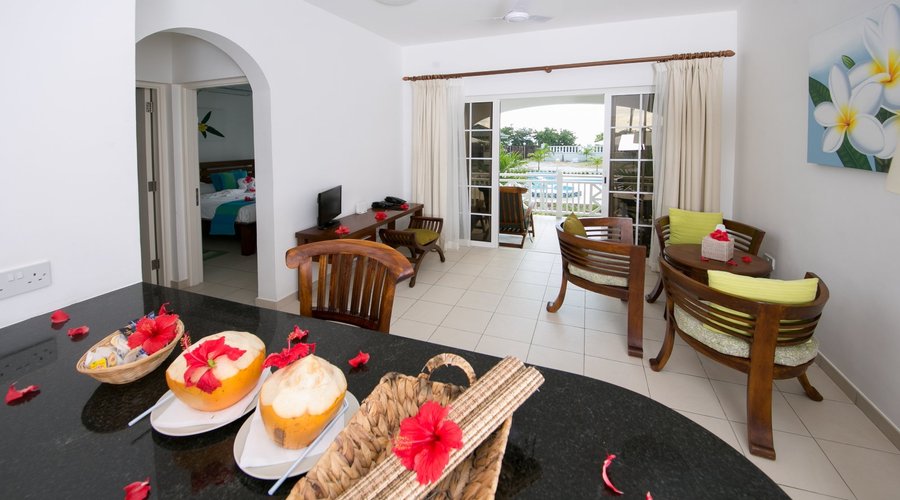 Apartment's bedroom, living room, kitchen area & veranda