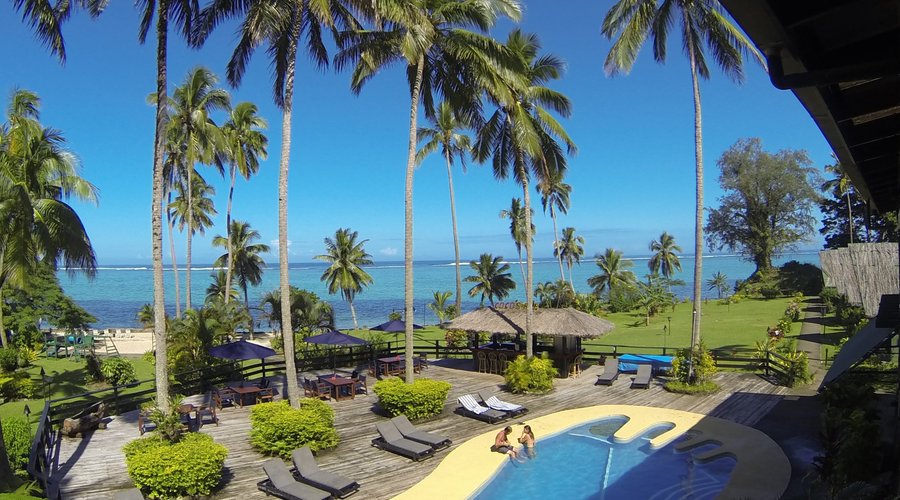 Relax by the pool and the thatched Pool Bar