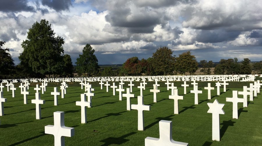 White marble headstones marking the graves