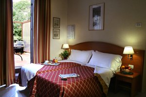 Hotel delle Muse in Rome, image may contain: Bedroom, Bed, Furniture, Indoors