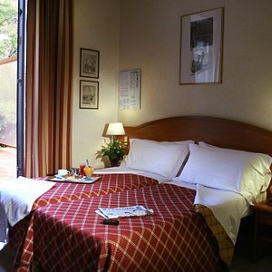 Hotel delle Muse in Rome, image may contain: Bedroom, Bed, Furniture, Indoors