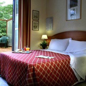 Hotel delle Muse in Rome, image may contain: Bedroom, Bed, Furniture, Indoors