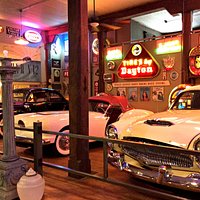 Tons of cars, gas pumps, signs - pop culture!