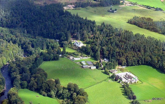 Aerial view of Logie House, and Logie Steading by the river Findhorn
