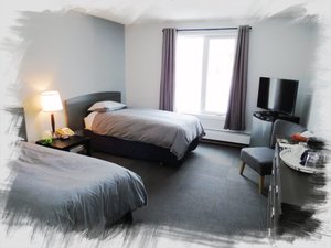 Churchill Hotel & Guesthouse in Churchill, image may contain: Dorm Room, Bed, Monitor, Screen