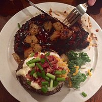 Steak topped with mushroom and a loaded baked potato. Yum!