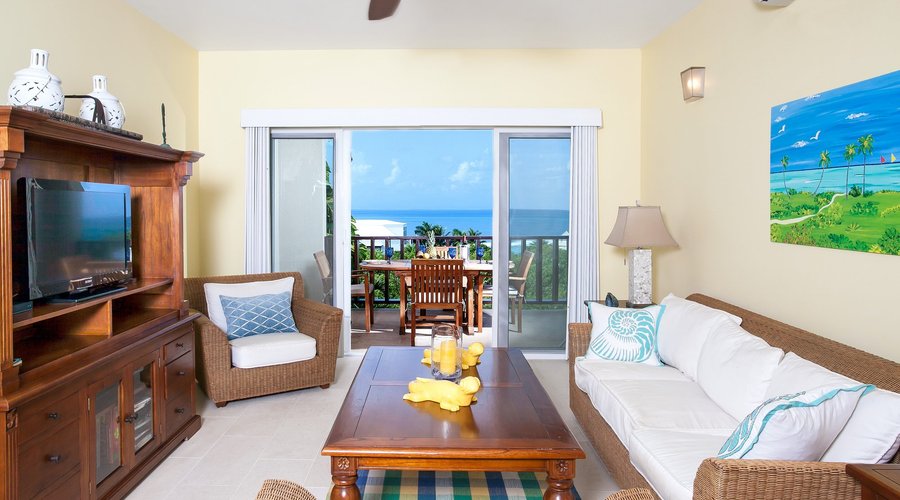 Spacious living area with large flat screen TV
