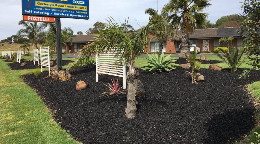 Front entrance gardens and sign