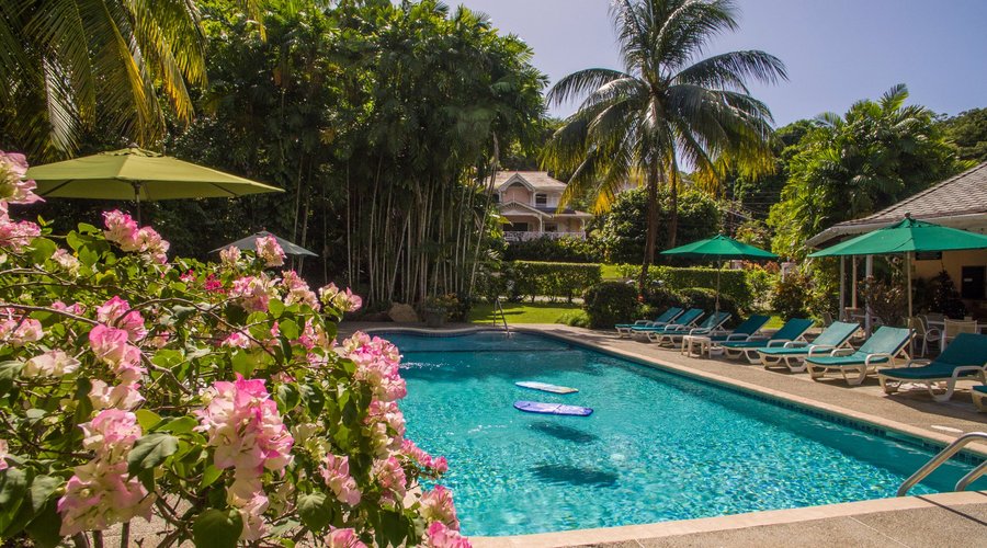Poinciana villa as seen across the pool. Beach bar on the right.