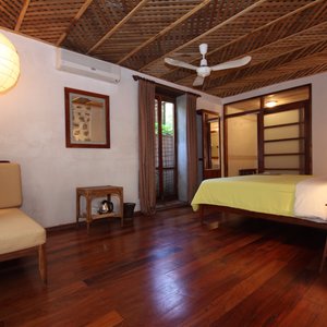 Sala Prabang in Luang Prabang, image may contain: Furniture, Bed, Remote Control, Lamp