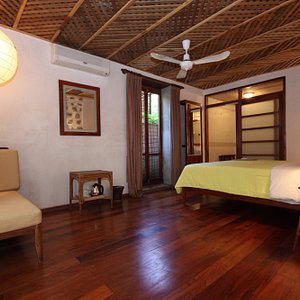 Sala Prabang in Luang Prabang, image may contain: Furniture, Bed, Remote Control, Lamp
