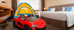 Fantasy Castle Theme Floor Guest Room equipped with kid's electric car and tent