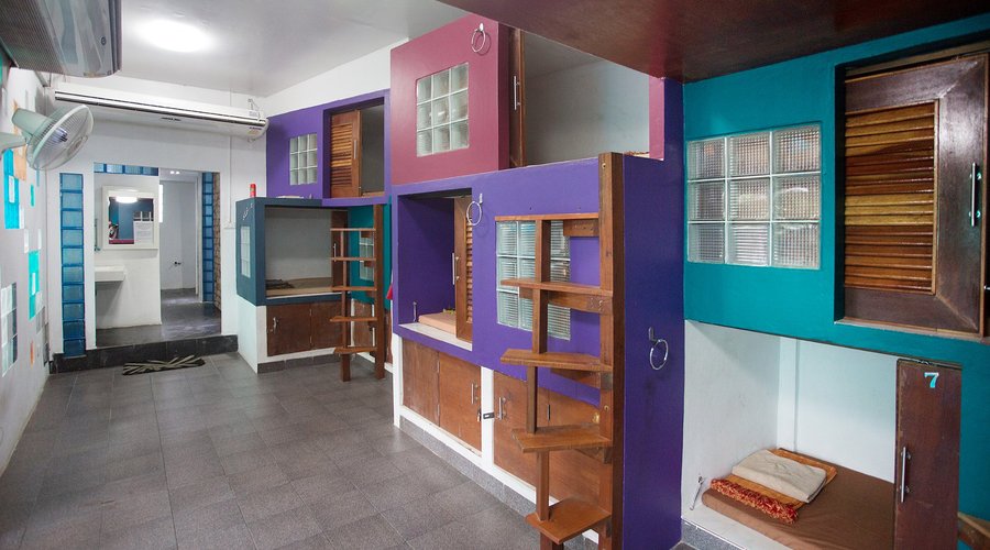 Lockers underneath to store your things, shared bathroom through the back