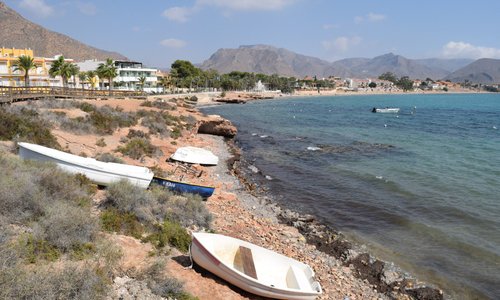 The view of the beach next to the Banos de la Marrana from the wooden walkway