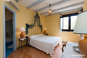 Marulivo Hotel in Pisciotta, image may contain: Furniture, Bedroom, Indoors, Lamp